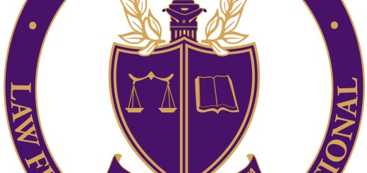 Phi Alpha Delta logo. Purple circle and shield with gold letters.